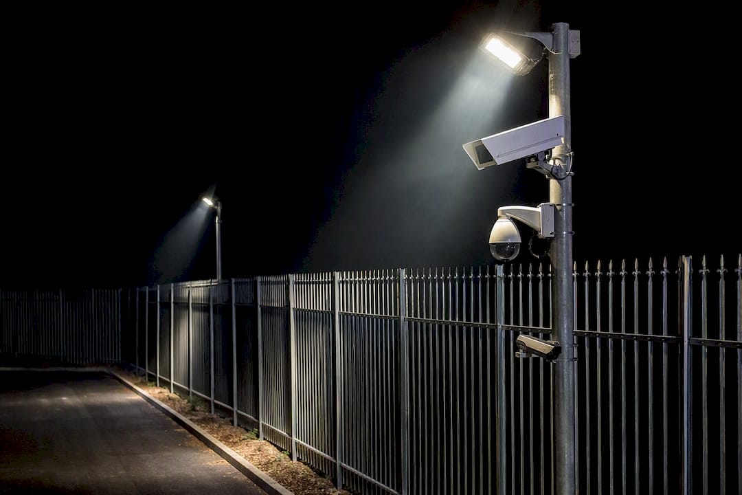 Perimeter lighting and cameras at nighttime perimeter