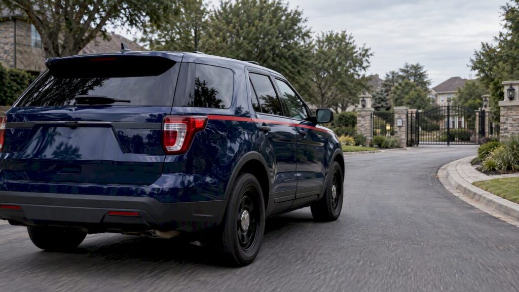 Security patrol SUV on a residential community road